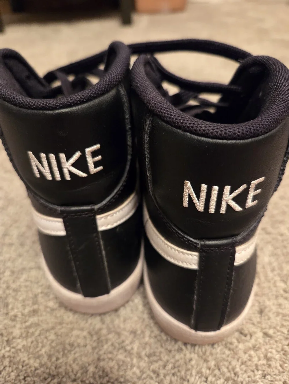 Nike Kids Black High-Top Sneakers with White Swoosh Accent